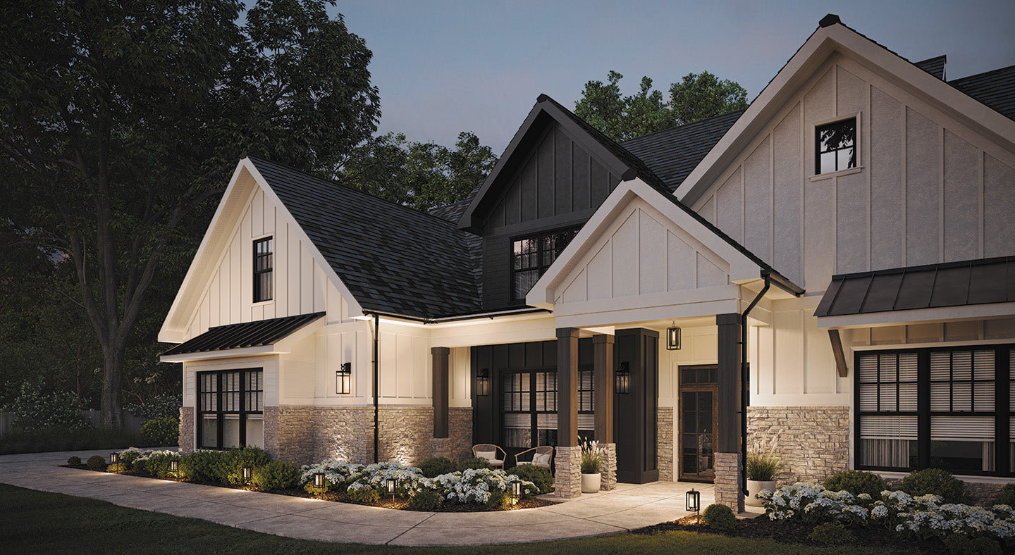 Beautiful house exterior with board and batten architectural details at dusk and outdoor lighting on