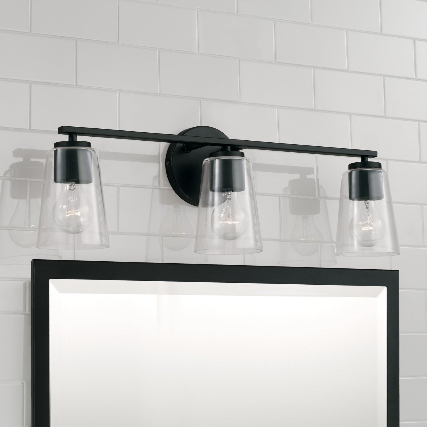 Portman 3-Light 25 in Bathroom Vanity Light with Clear Glass Shade