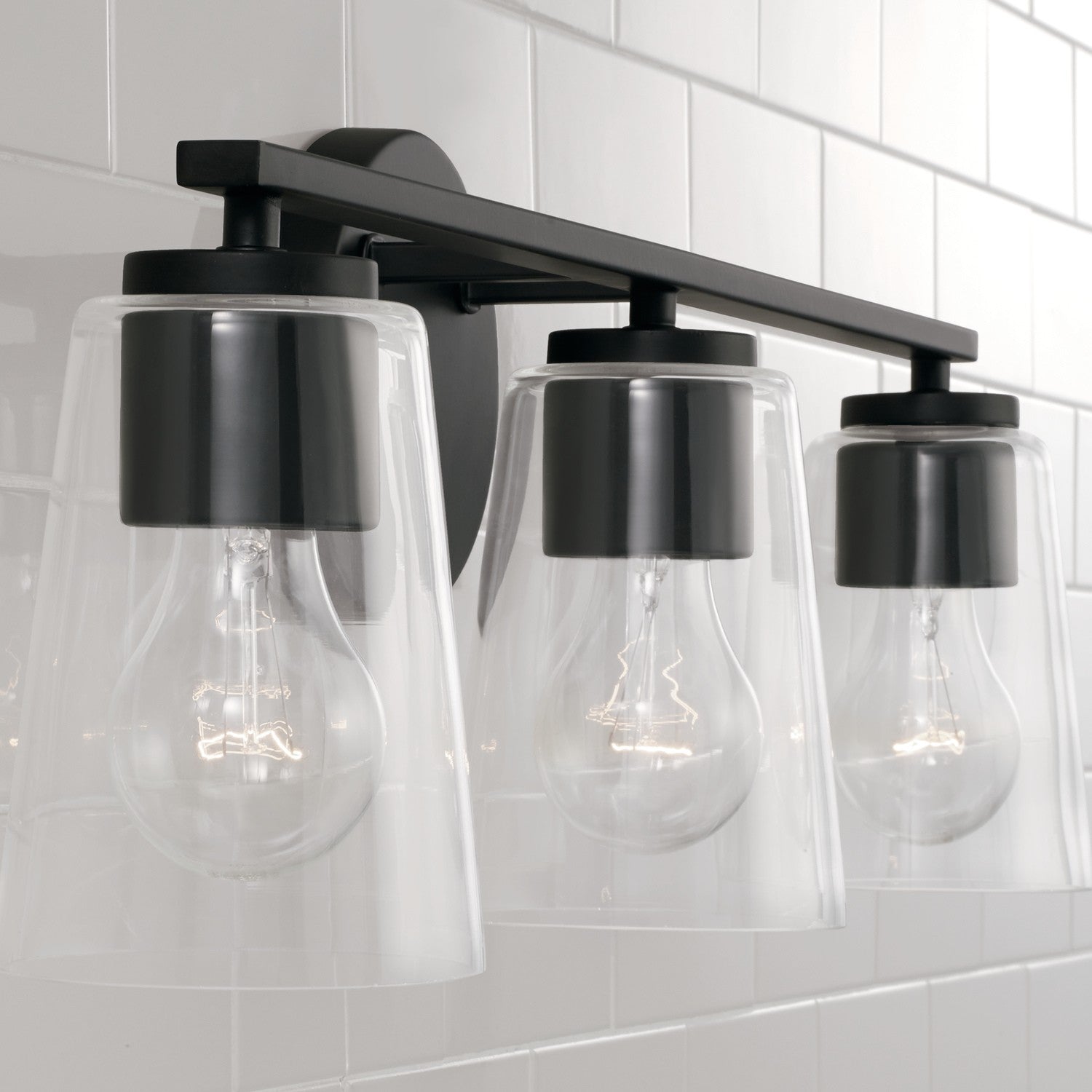 Portman 3-Light 25 in Bathroom Vanity Light with Clear Glass Shade