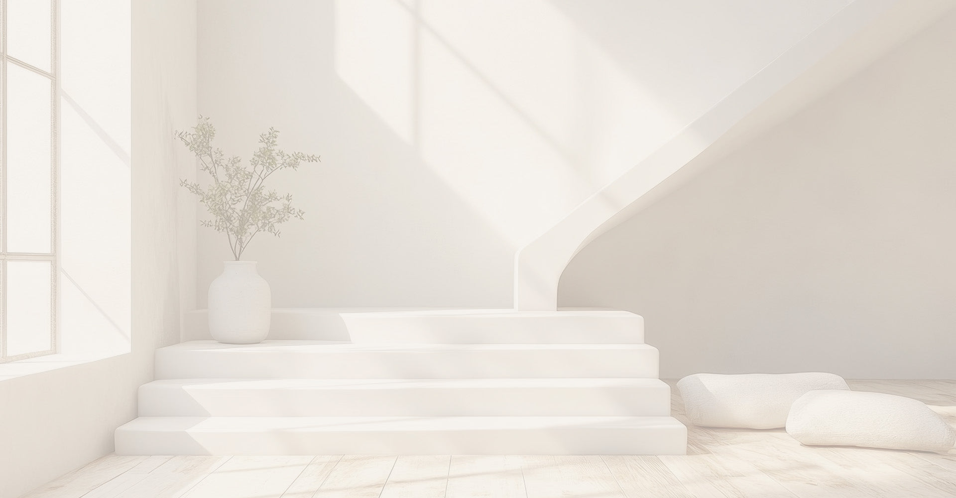 Muted image of a white room with white steps and a simple potted plant