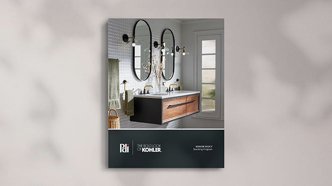 Bathroom design book with Kohler branding on a gray background